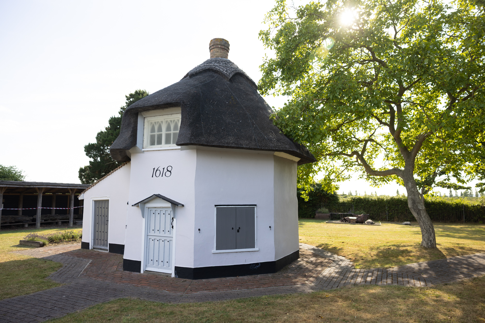 Dutch cottage museum with sunlight coming through the trees